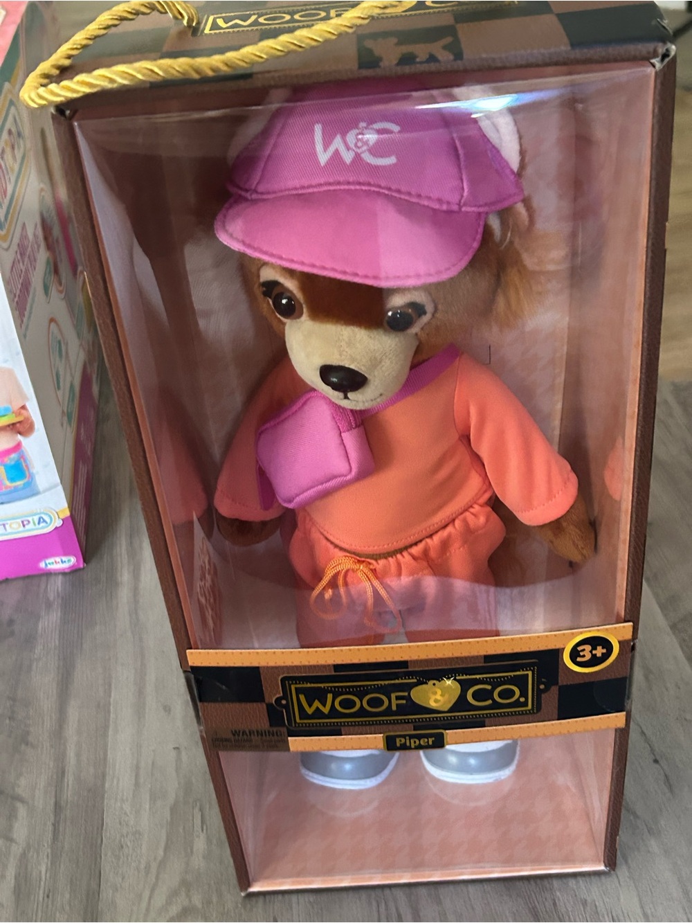 Piper Plush Dog — Pink Cap & Orange Outfit